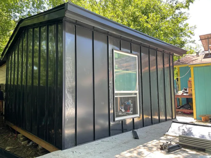 Black standing seam metal wall panels for Roof Inspection in The Hammocks
