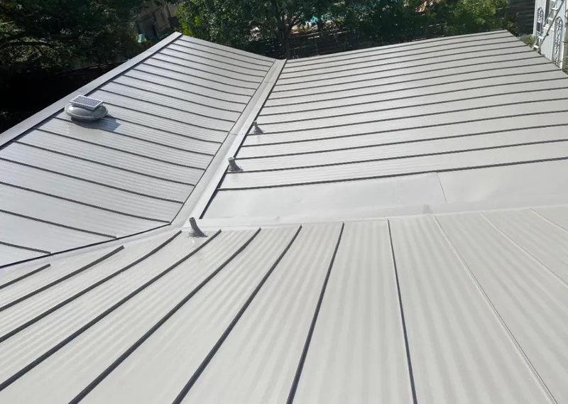 Solar attic fan installed on a metal roof for Roof Ventilation in The Hammocks